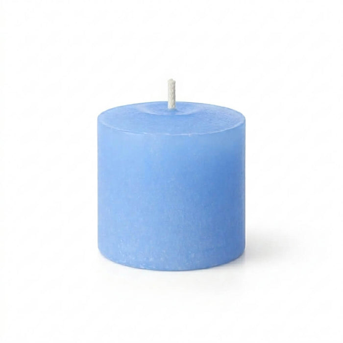 Unlit Light Blue candle on a solid white background