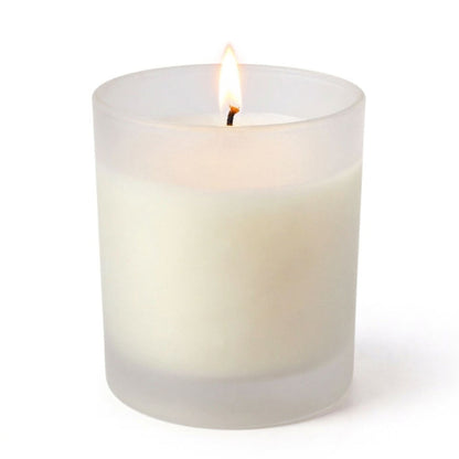 Frosted Votive Holder with a single burning white candle