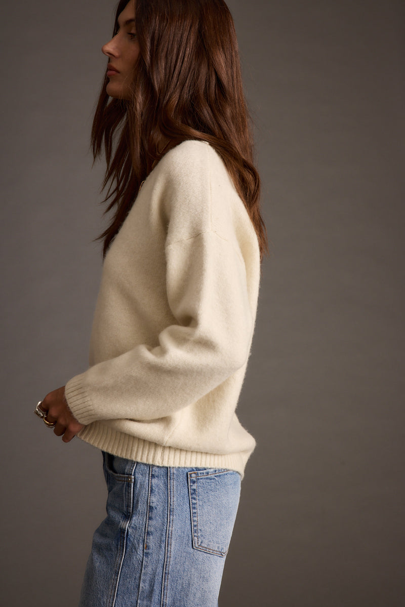 Robbyn Ivory Sweater paired with complementary accessories for a polished look.