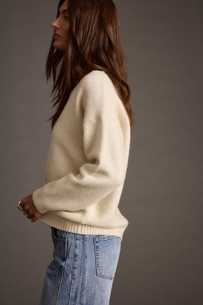 Robbyn Ivory Sweater paired with complementary accessories for a polished look.