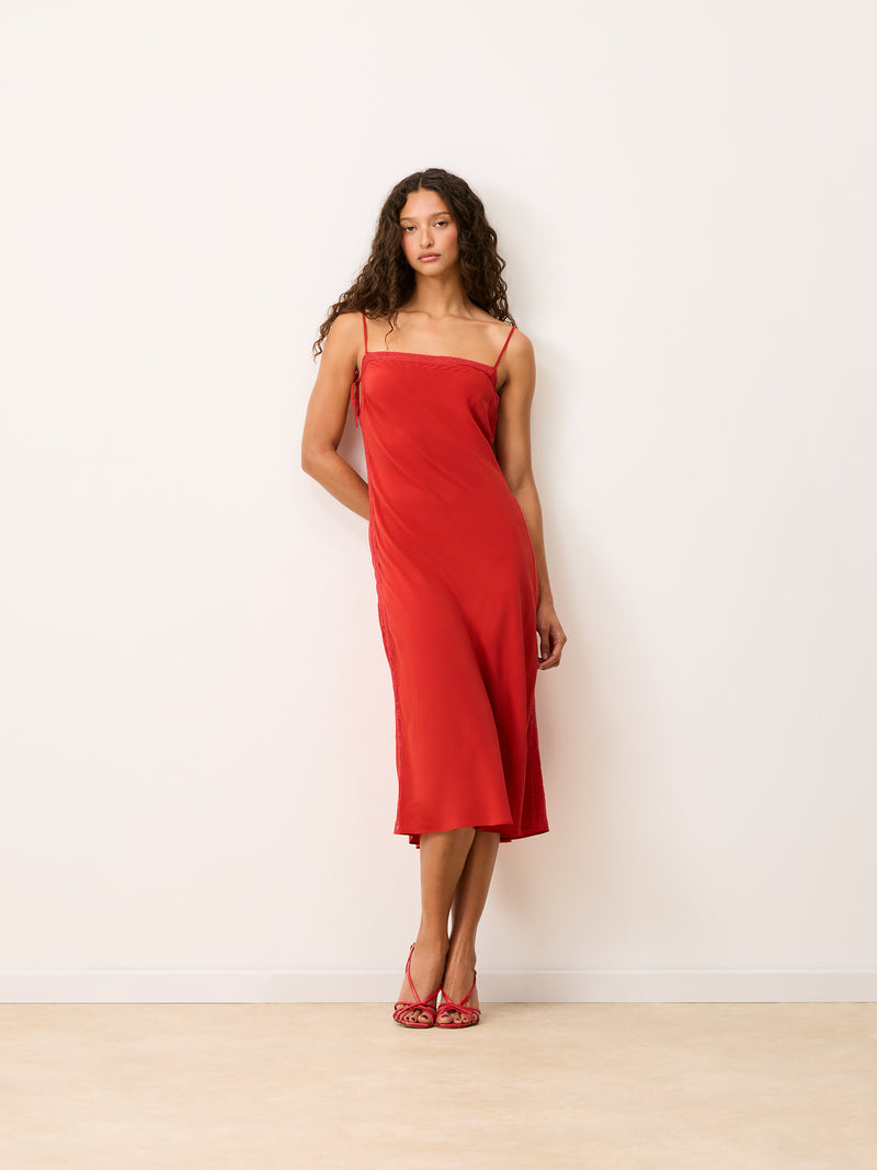 VICKY red silk midi dress worn on a model by Rouje