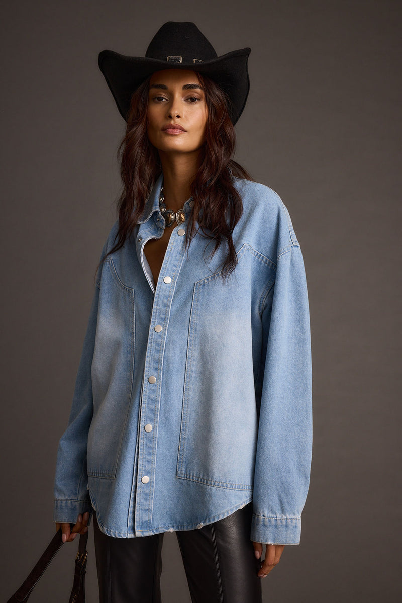 Back view of the denim top showing the silhouette and fit.