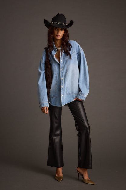 Detail shot of the Ryland Black Vegan Leather Flare Pants highlighting the flared elements.