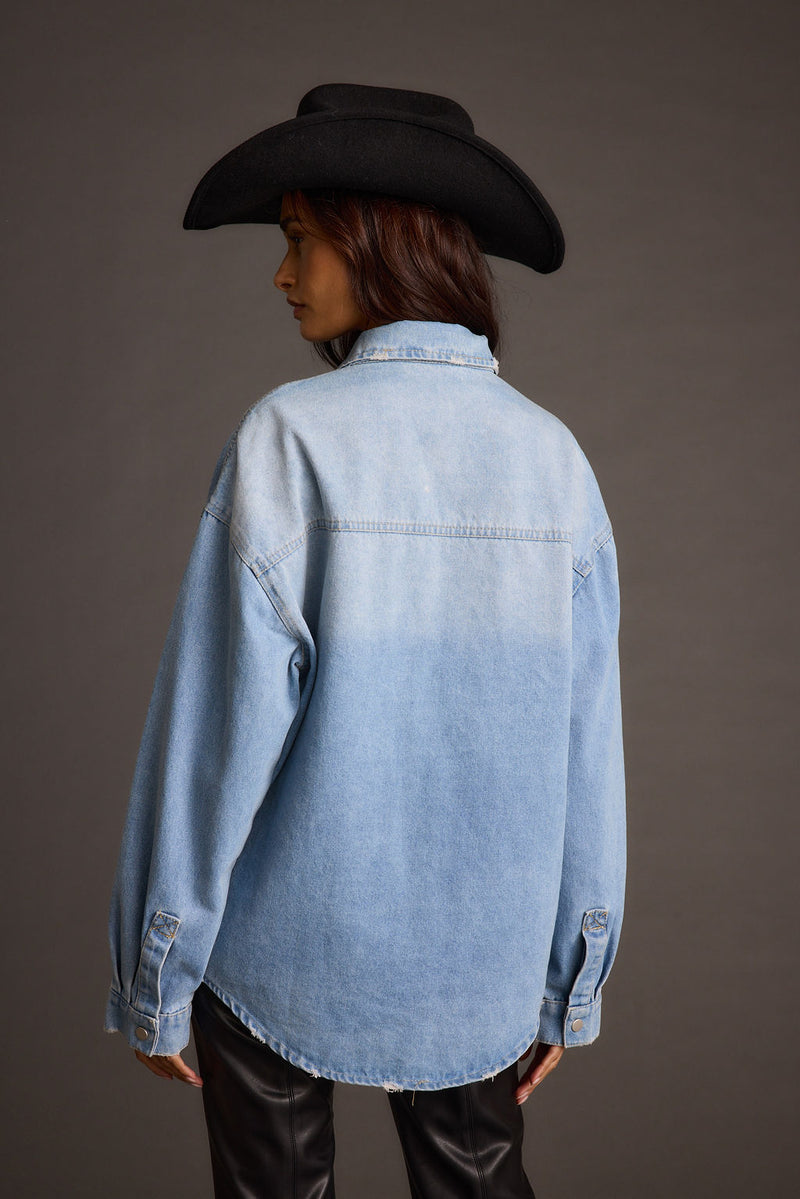 Full-length view of the top showing the drape and movement.
