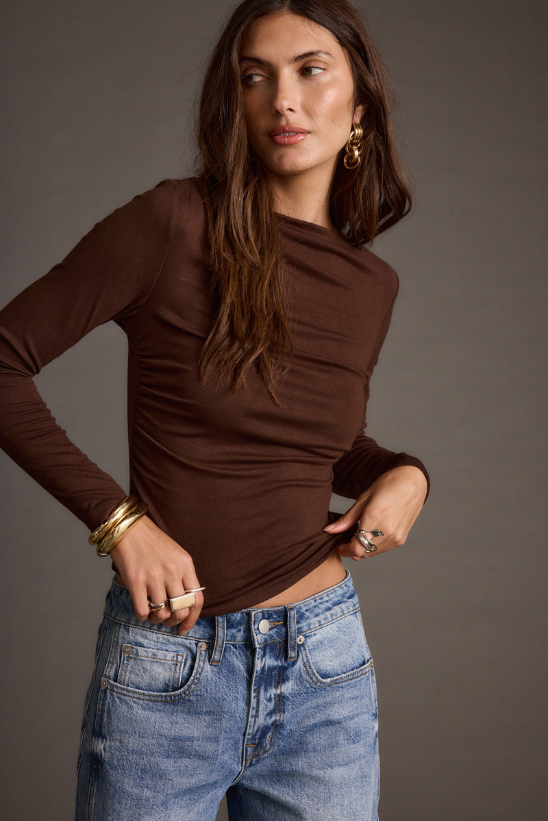 Espresso top with refined detailing and a flattering silhouette.