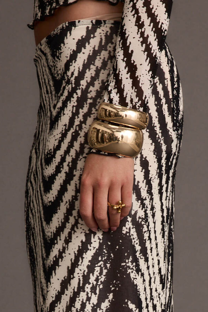 Close-up of the Runyon Set of 2 Gold Cuff Bangles showcasing the fabric texture and design details.