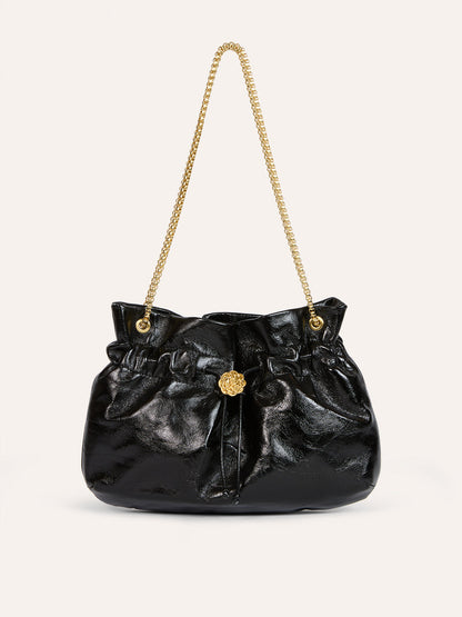 ANISETTE black aged leather bucket bag worn on a model by Rouje