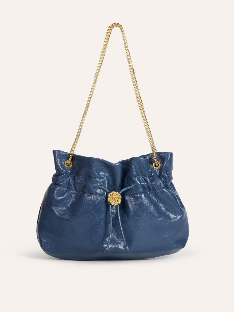 ANISETTE denim-effect leather bucket bag worn on a model by Rouje
