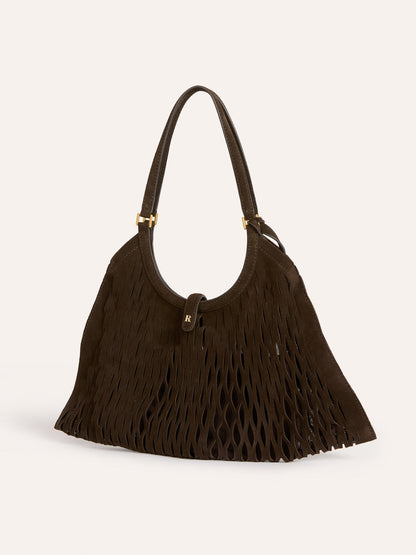 CHOUQUETTE ebony laser-cut leather bag worn on a model by Rouje