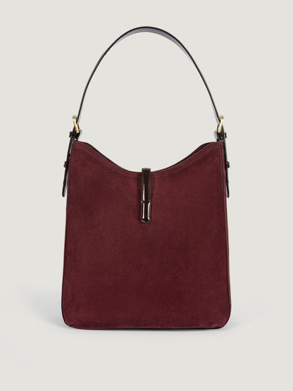 COMPTOIR plum calfskin messenger bag worn on a model by Rouje
