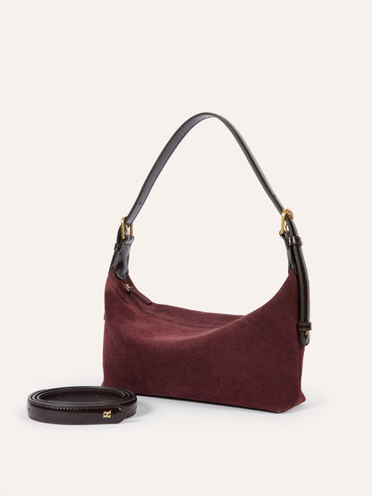 MINUIT plum calfskin soft bag worn on a model by Rouje
