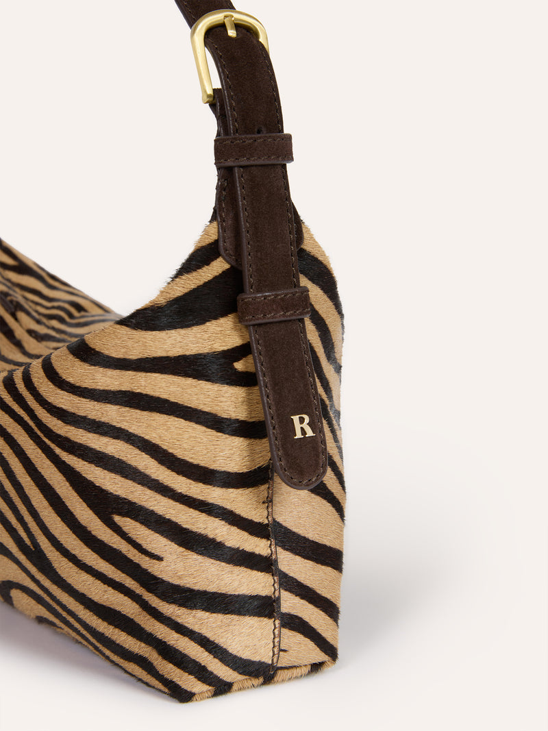MINUIT zebra pony soft bag worn on a model by Rouje
