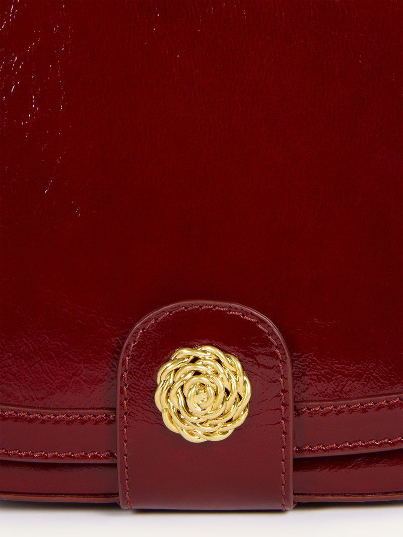 TROQUET burgundy patent leather bag, detail of gold R logo by Rouje