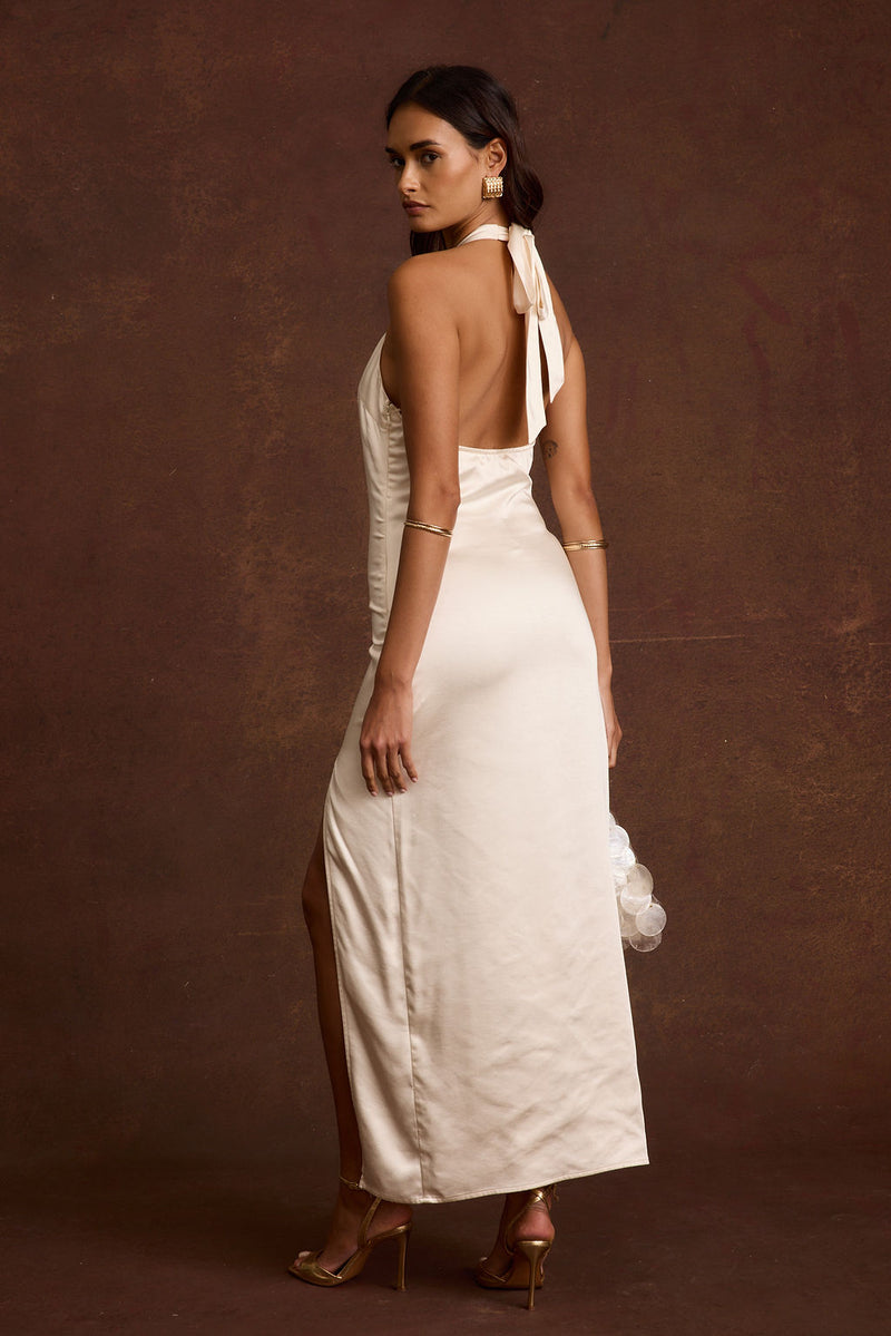 Back view of the ivory satin maxi dress showing the silhouette and fit.