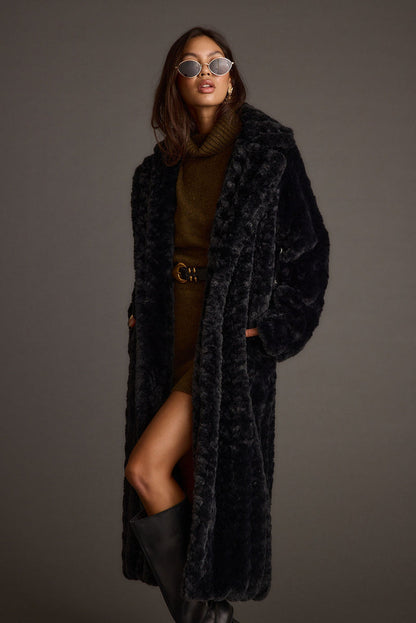 Close-up of the Sasha Black Floor Length Coat showcasing the fabric texture and design details.