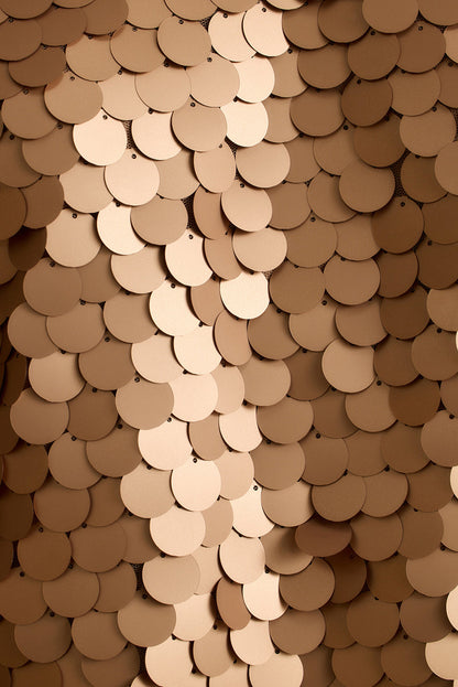 Overlapping rose gold payette sequin disks form a fish-scale texture on the Seaton tank.