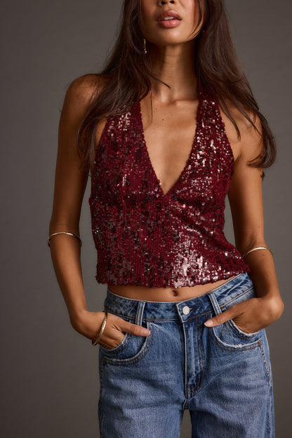 Sequin halter halter top with refined accents, a sequin top essential.