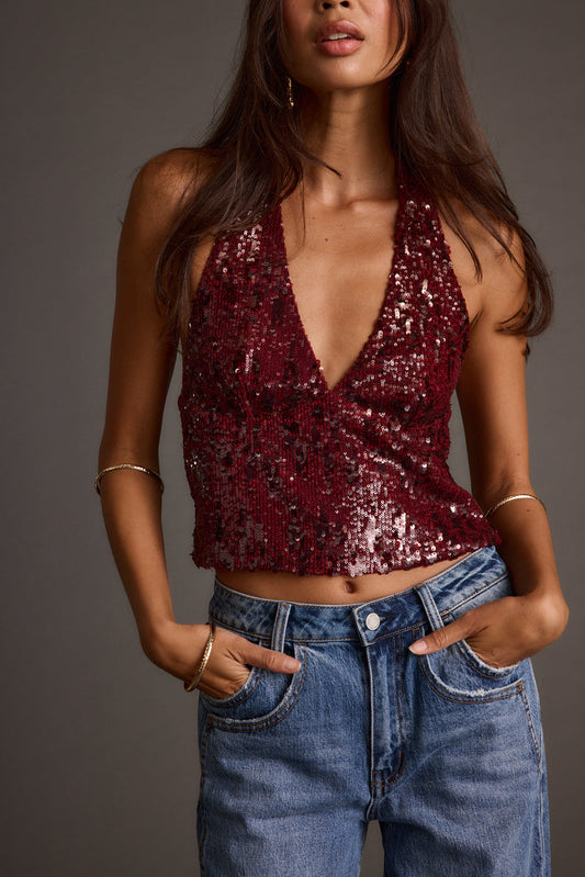 Sequin halter halter top with refined accents, a sequin top essential.
