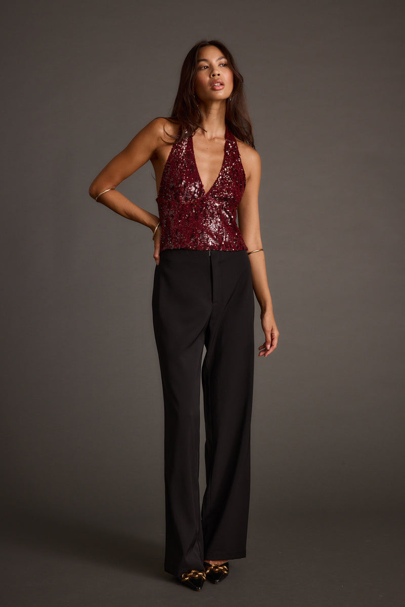 Full-length view of the halter top showing the drape and movement.