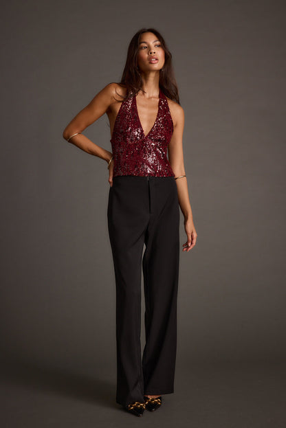 Full-length view of the halter top showing the drape and movement.