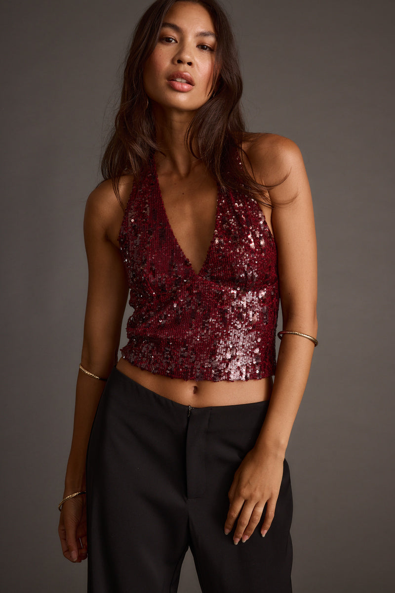 Detail shot of the Selena Mulberry Sequin Halter Top highlighting the halter elements.