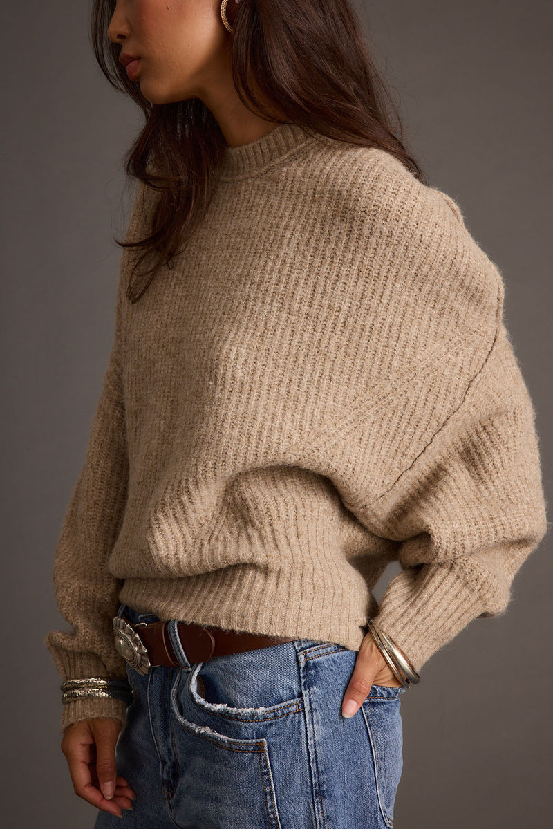 Alternate angle of the sweater highlighting the overall design.