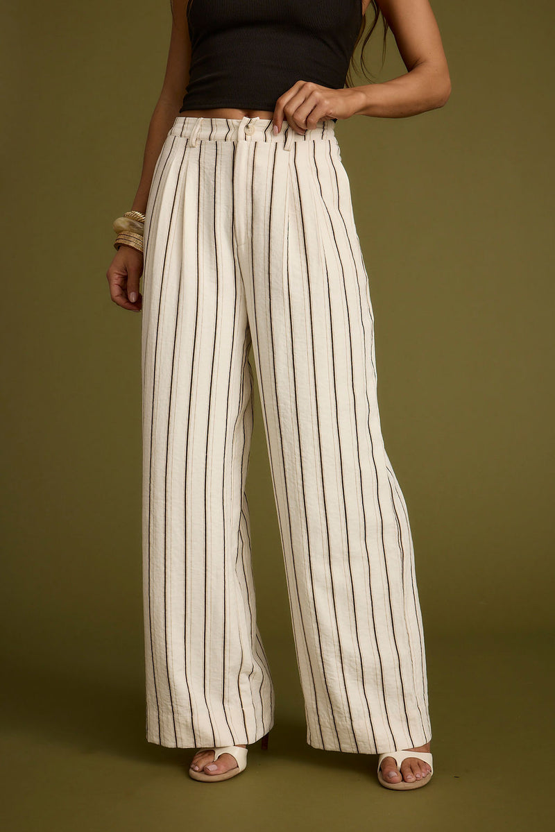 Full-length view of the pants showing the drape and movement.