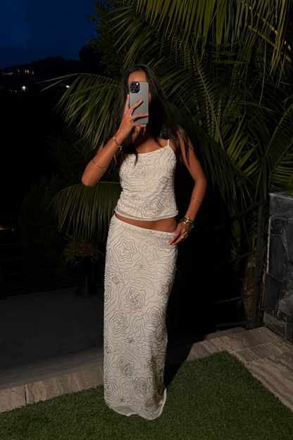 Luci White Beaded Tank paired with complementary accessories for a polished look.