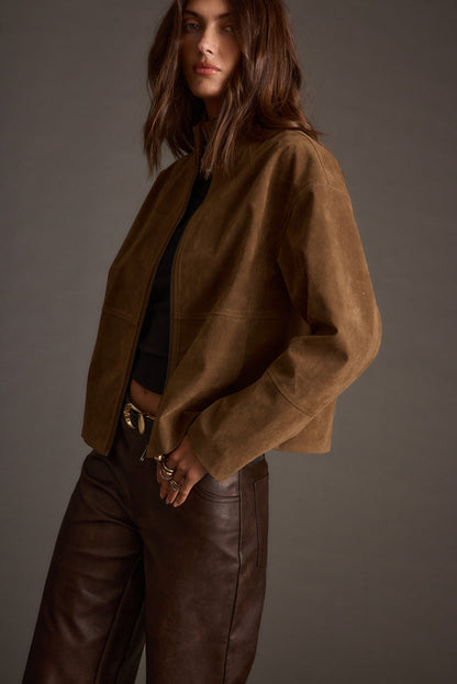 Lifestyle shot of the brown jacket styled for day-to-night versatility.