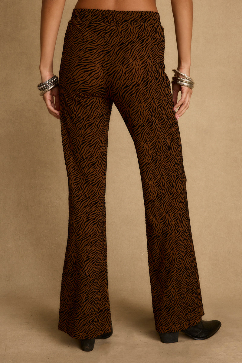 Silver Springs Cognac Zebra Flare Pants styled in a complete look from an alternate angle.