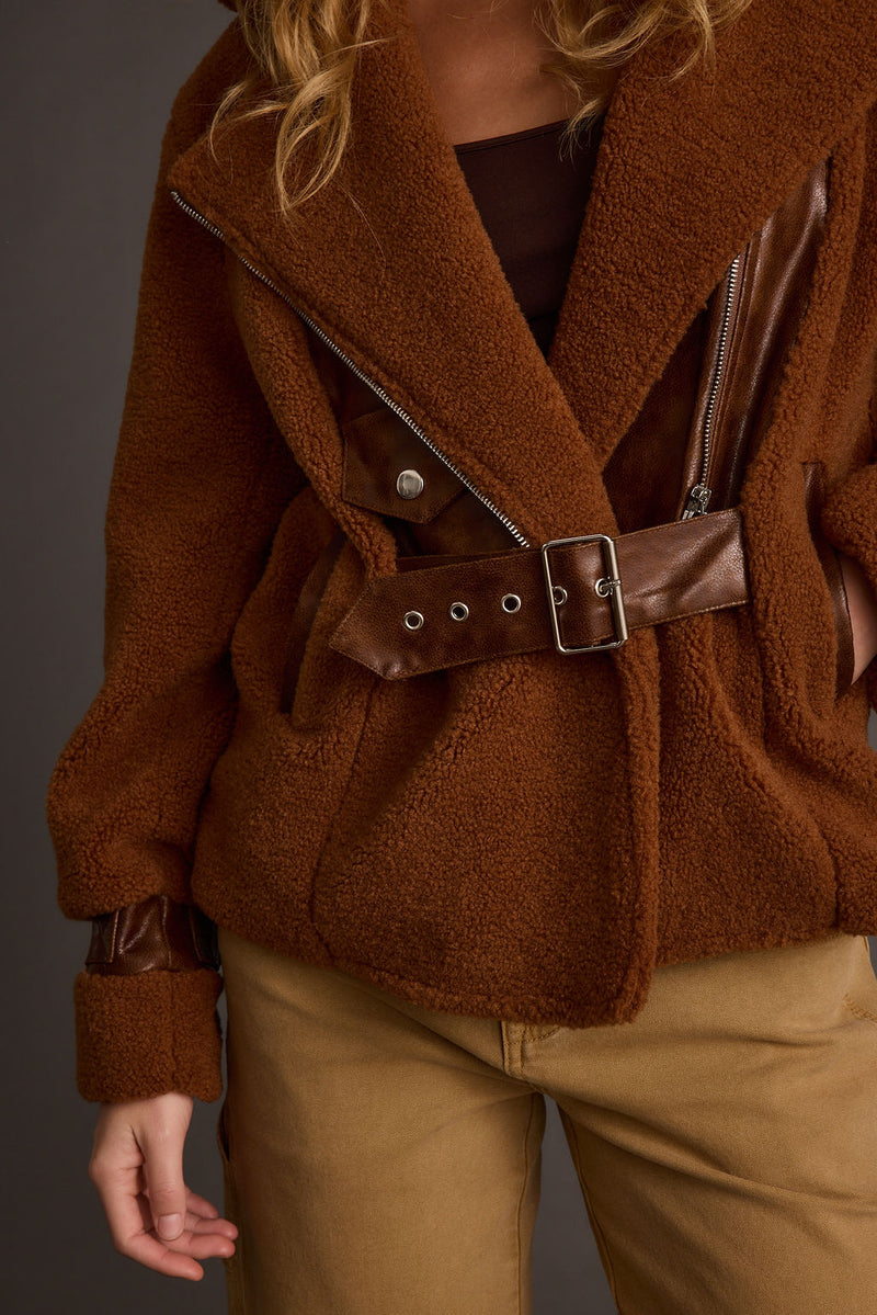 Back view of the mocha jacket showing the silhouette and fit.