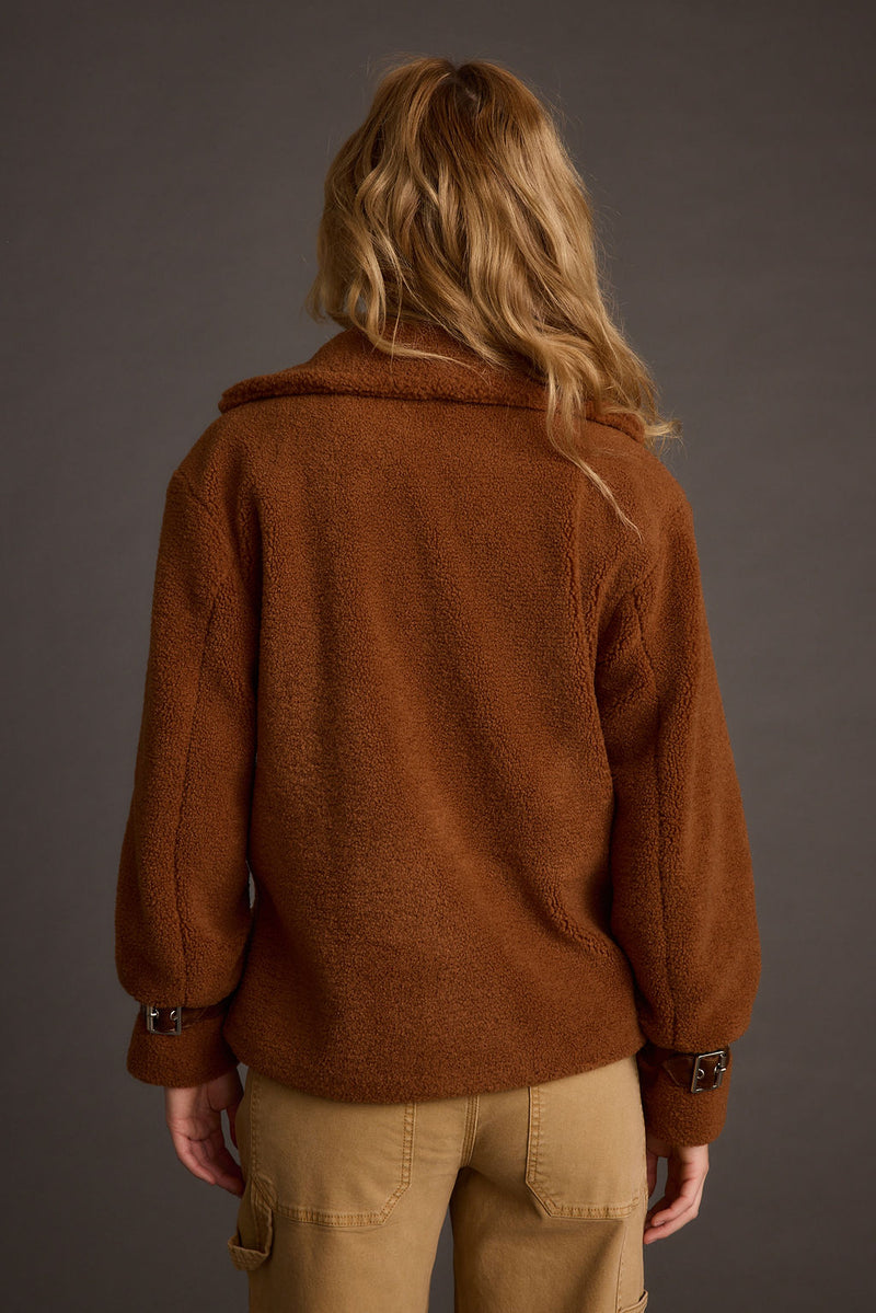 Full-length view of the mocha jacket showing the drape and movement.