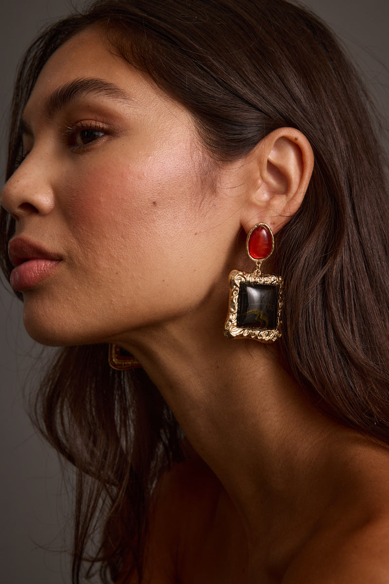 Soleil Statement Earrings shown from a different angle, highlighting the metalwork details.