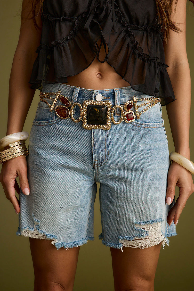 Close-up of the Soleil Statement Stone Gold Chain Belt showcasing the fabric texture and design details.