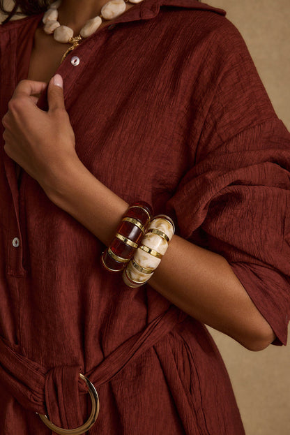 Close-up of the Soreya Resin and Gold Bangles showcasing the fabric texture and design details.