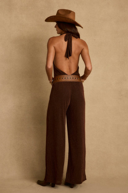 Back view of the espresso jumpsuit showing the silhouette and fit.
