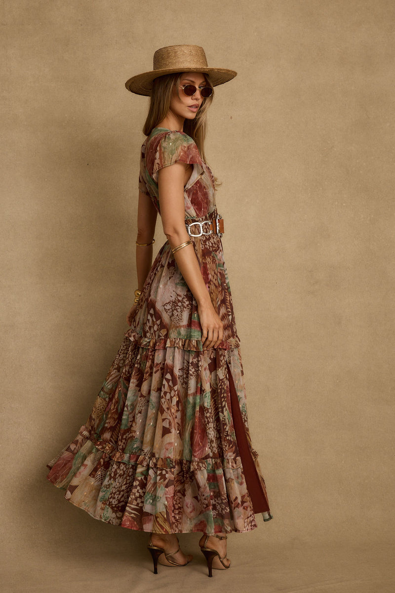 Lifestyle shot of the rust maxi dress styled for day-to-night versatility.