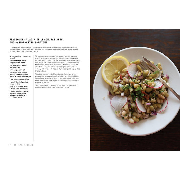 Plated salad with lemon, radishes, and oven-roasted tomatoes on a white plate with a fork, next to a recipe text.