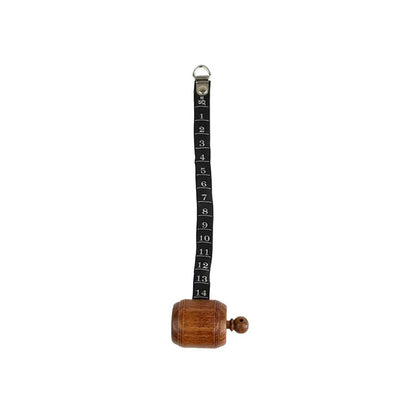 Wooden measuring tape with black ribbon unfurled.